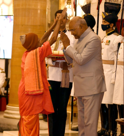 Nanda Prusty Raised His Hands In A Gesture Of Blessing The President